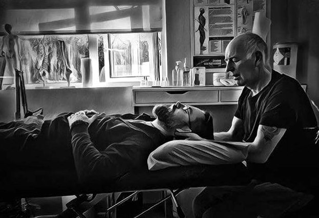 A practitioner giving a treatment at the clinic